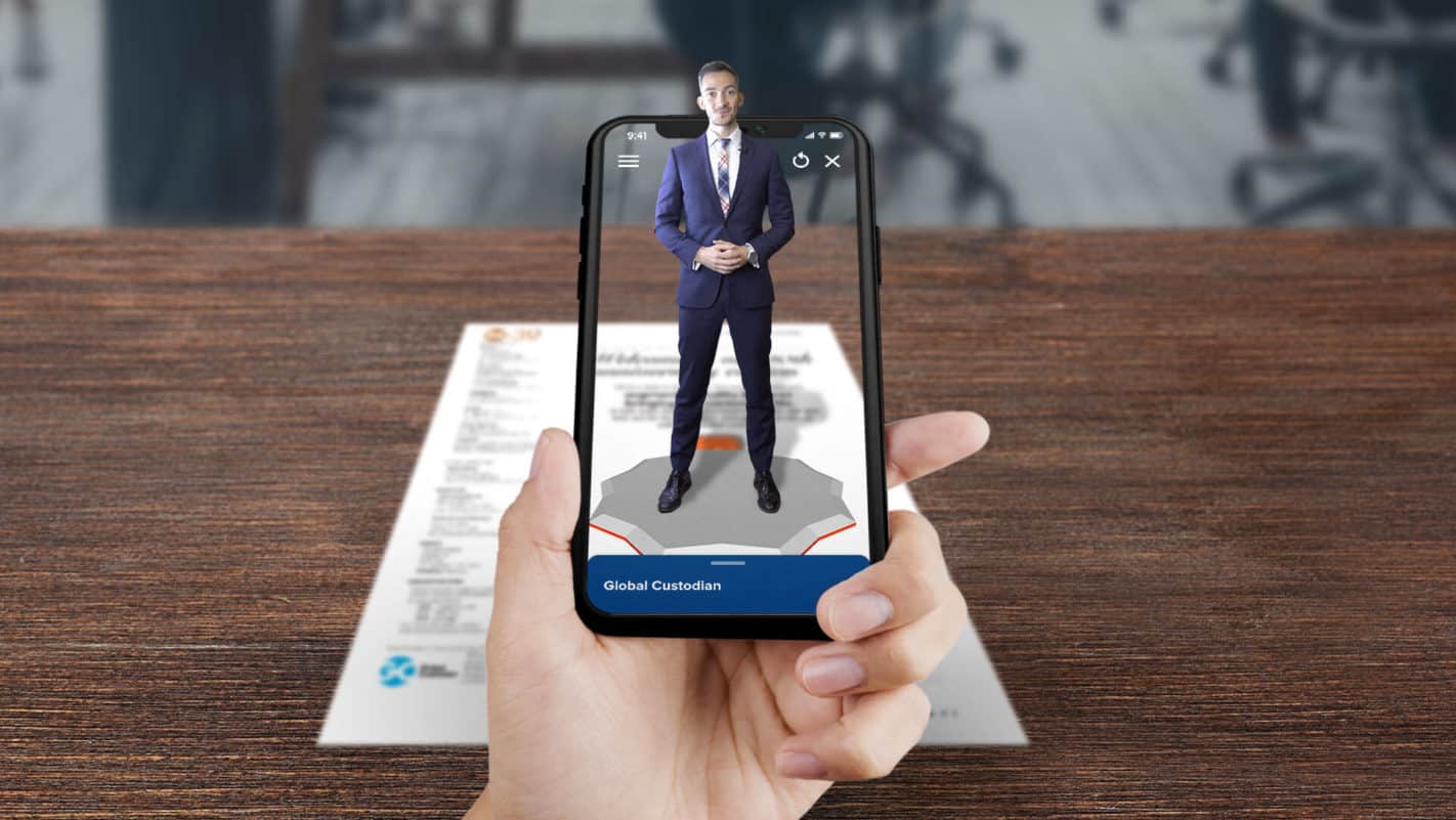 A phone being used to scan a document to experience augmented reality.