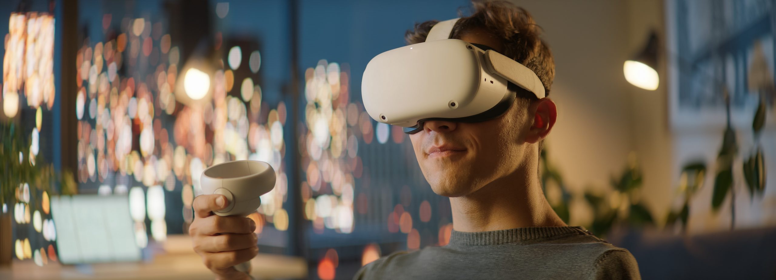 A person wearing a VR headset with a white controller in their right hand.